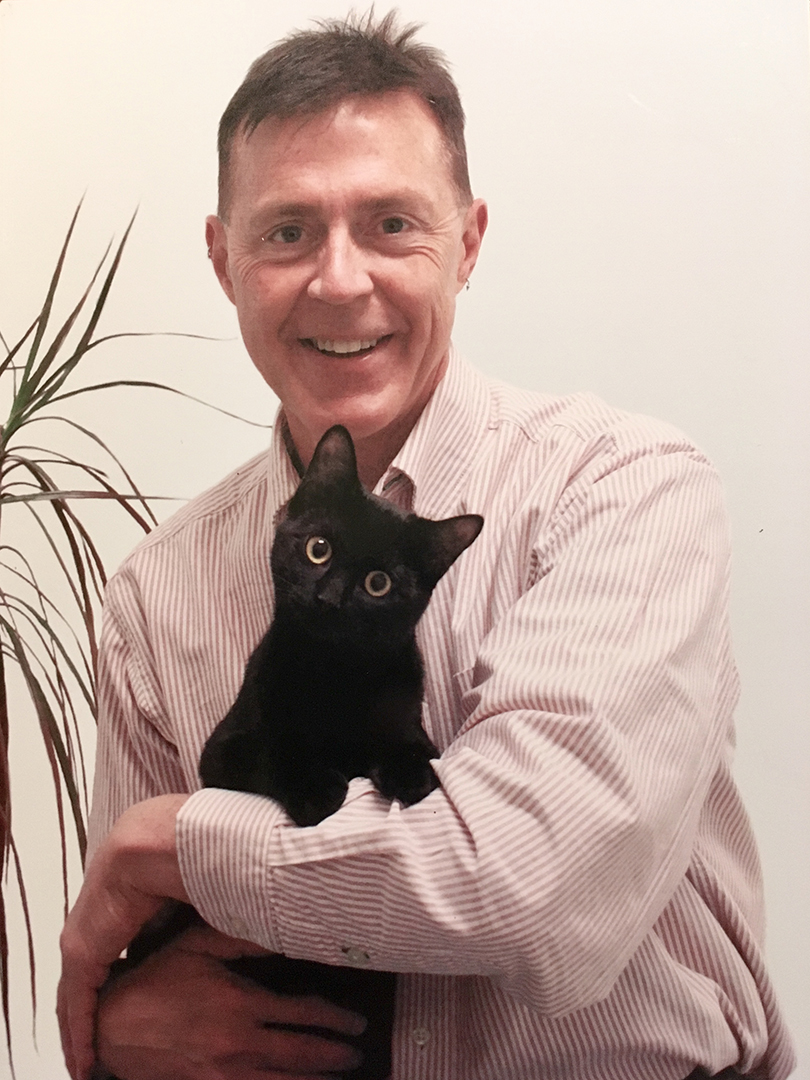 Dr. Michael Powell's love of cats was well known among his friends. Submitted photo. 